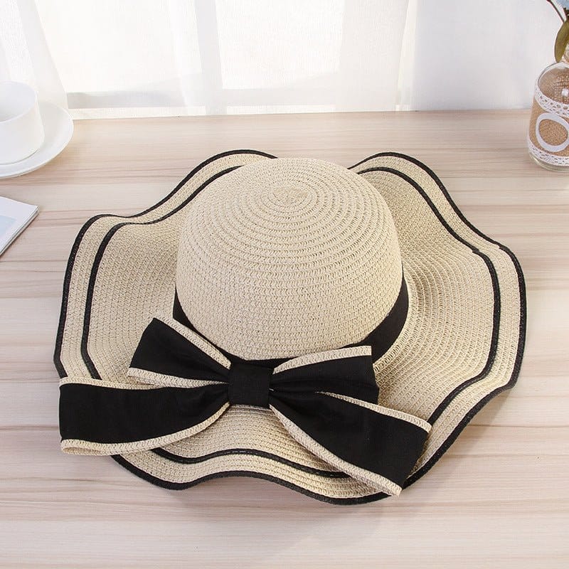 beach hats for women with a stylish bow, perfect sunshade for beach outings, made from high-quality straw material.