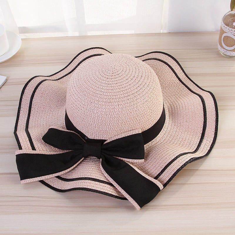 beach hats for women in pink straw with black bow, perfect sunshade for stylish beach outings.