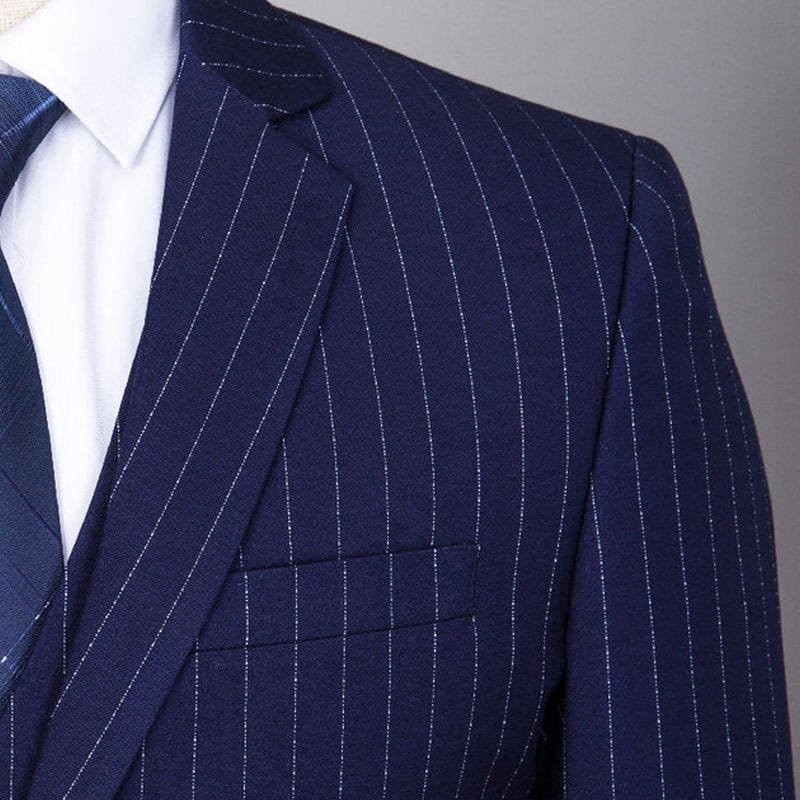Close-up of a navy blue striped three-piece suit for men with fine pinstripes and a tailored fit.