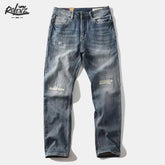 Shanxi stretchy slim straight pants displayed in a casual, stylish blue denim design with distressed details.