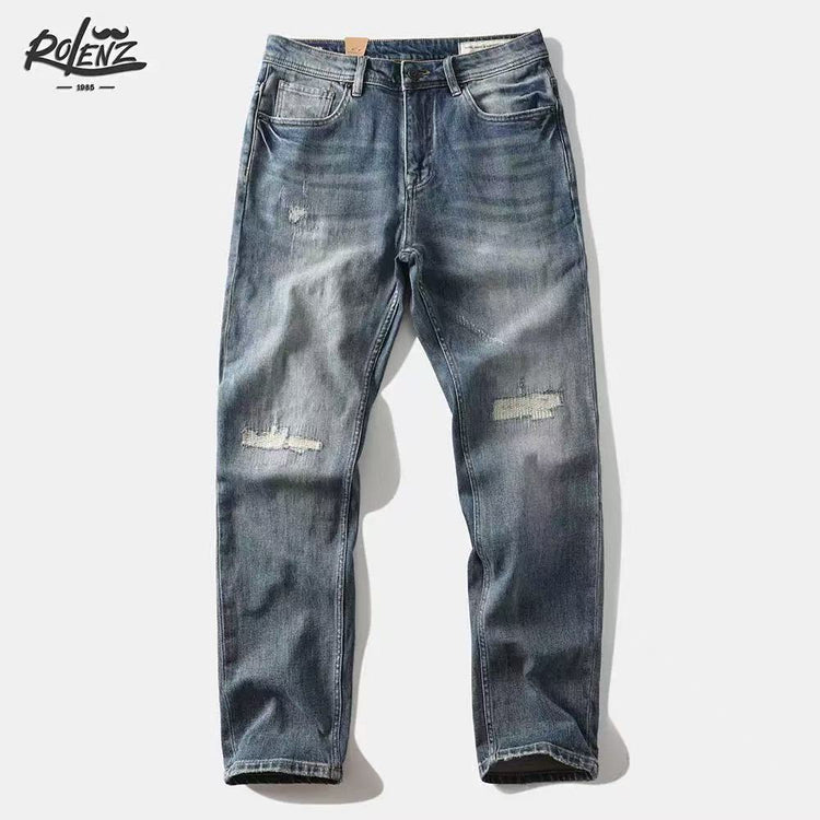 Shanxi stretchy slim straight pants displayed in a casual, stylish blue denim design with distressed details.
