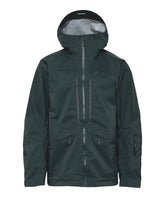 Nomad Jacket in deep forest color, a durable mountain jacket perfect for tough outdoor conditions.