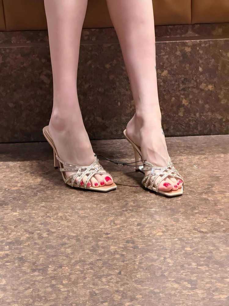Women wearing Water Diamond Square Head One Word Cold Slippers with fine heel and T-shaped upper.