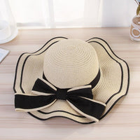 beach hats for women with a stylish bow, perfect sunshade for beach outings, made from high-quality straw material.