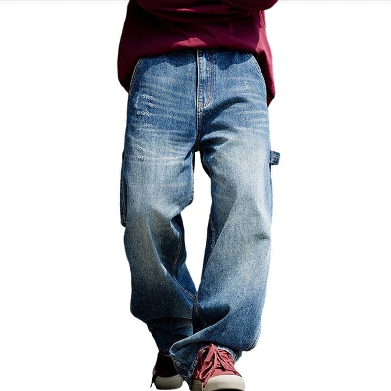 Model wearing blue denim cargo jeans with a relaxed fit and red sneakers.