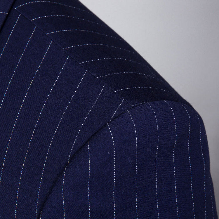 Close-up of a navy blue striped three-piece suit for men showcasing fine fabric details.
