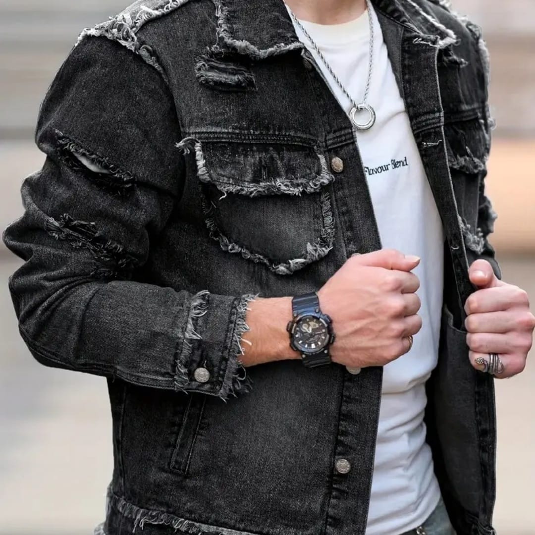 Man wearing a stylish formal denim jacket with distressed details and a white t-shirt underneath.