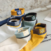 Maple Leaf Side-Logo Mens Short Socks in various colors displayed together on a flat surface.