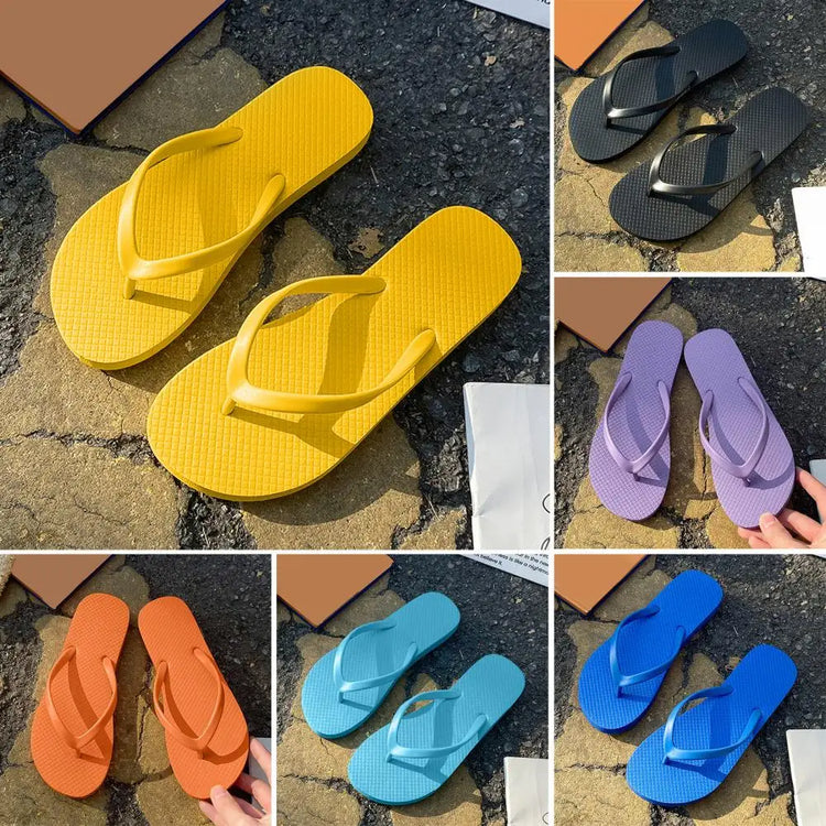 Colorful summer non-slip flip flops in yellow, black, orange, purple, and blue on a textured surface.