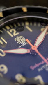 Close-up of Subnautica Automatic Diver Watch dial showcasing the brand logo and detailed design elements.