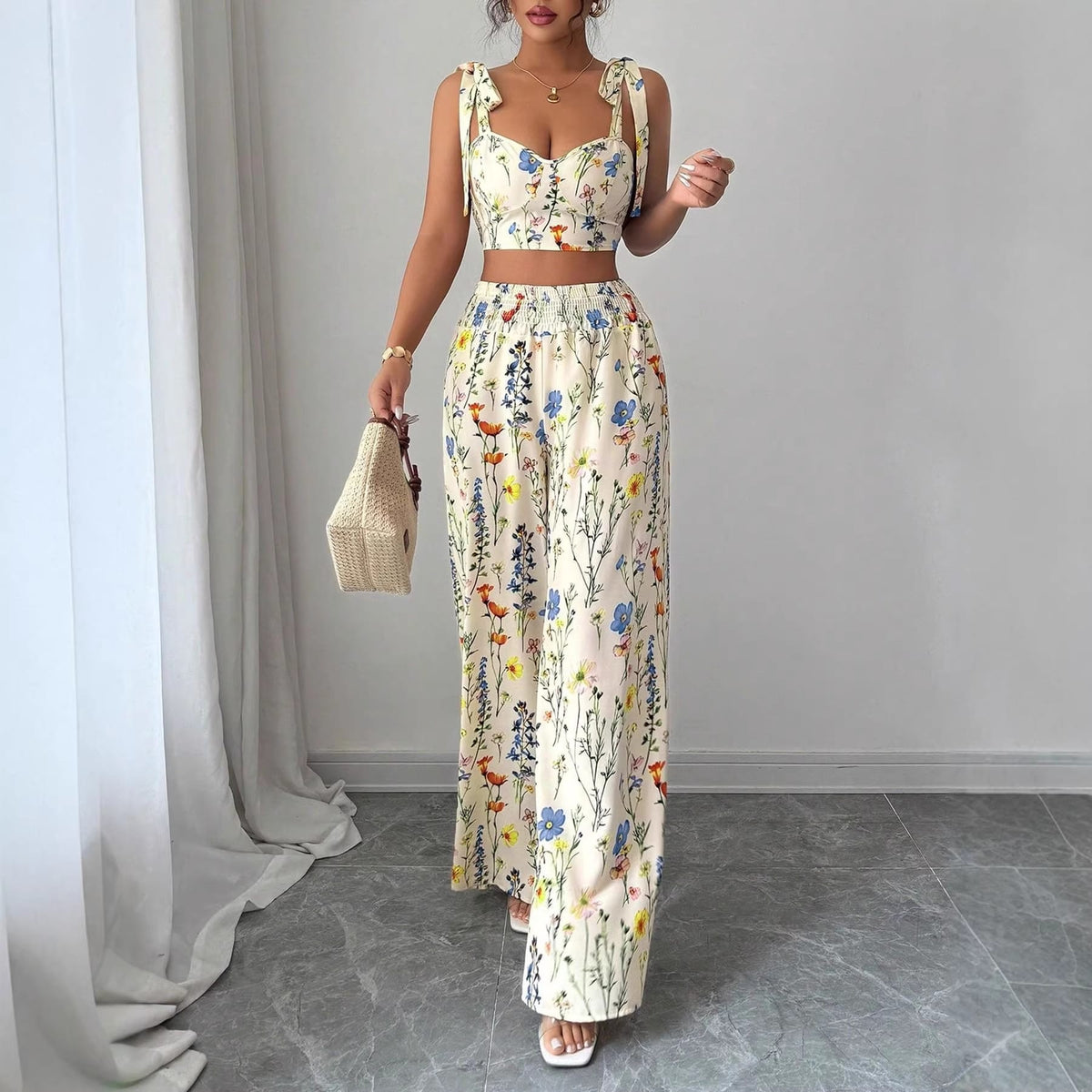 womens pyjama set printed camisole with floral design and matching trousers in elegant setting.