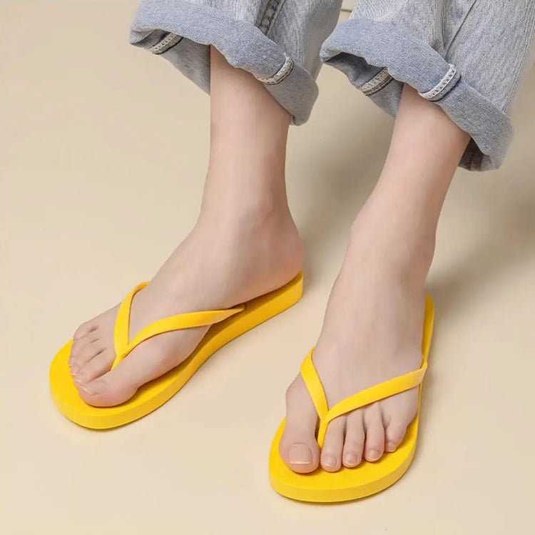Summer non-slip flip flops in yellow, perfect for home, shower, and beach outings.