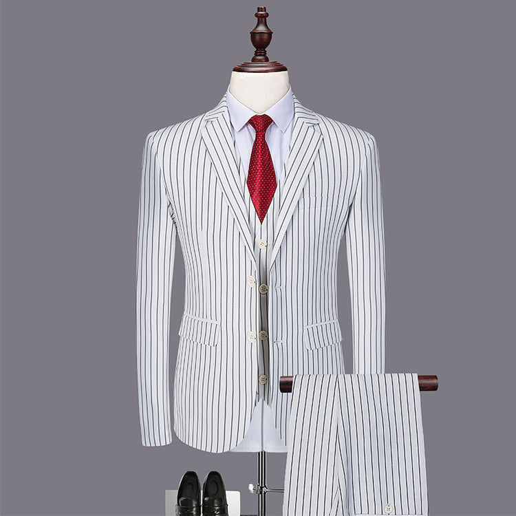 Mens fashionable and versatile striped three-piece suit for men in gray wide stripe with red tie and shoes