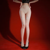 Model wearing Silver Silk Two-color Jacquard Stockings against a red background with high heels.