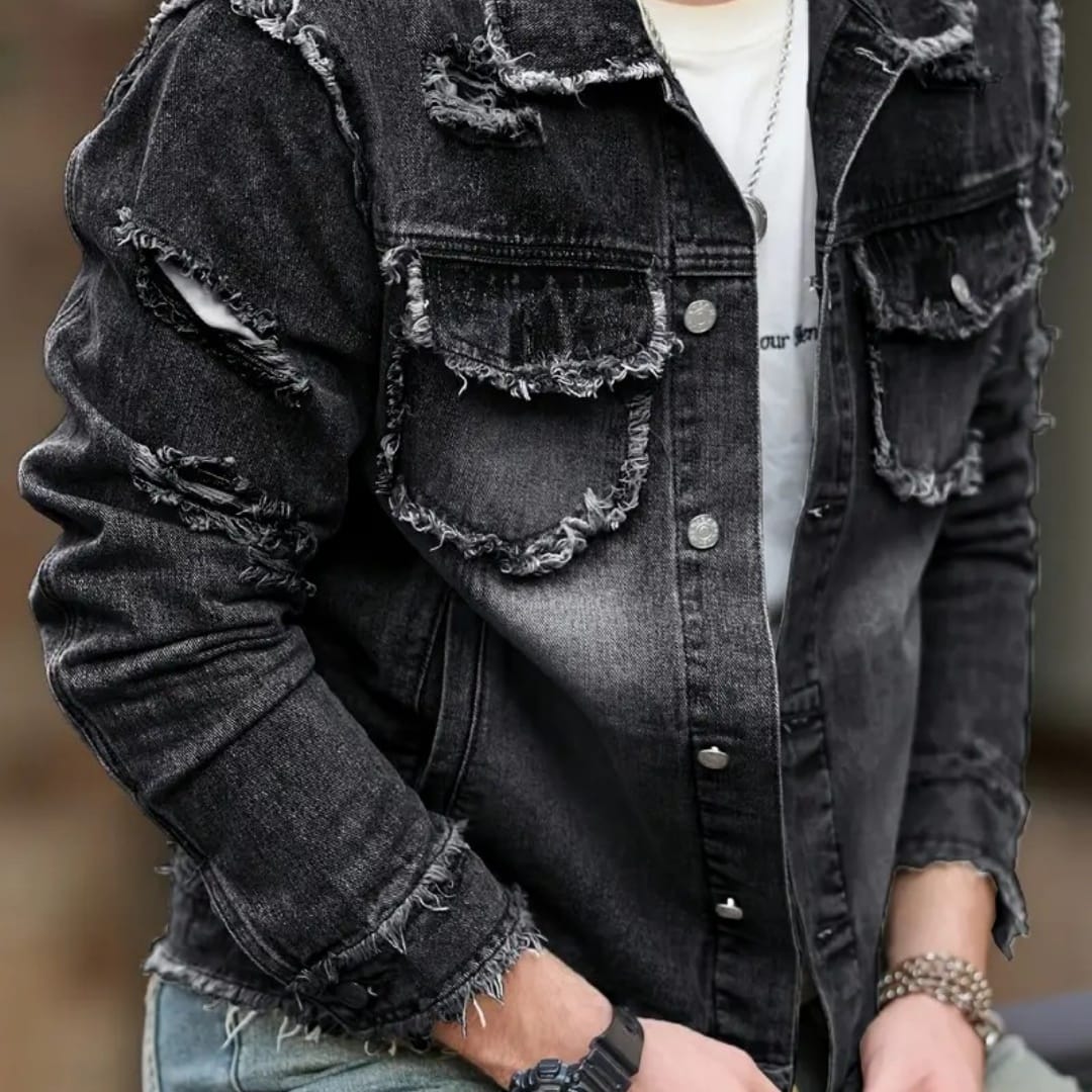 Stylish man wearing a formal denim jacket with distressed details and a well-fitting silhouette.