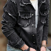 Stylish man wearing a formal denim jacket with distressed details and a well-fitting silhouette.
