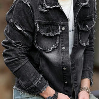 Stylish man wearing a formal denim jacket with distressed details and a well-fitting silhouette.