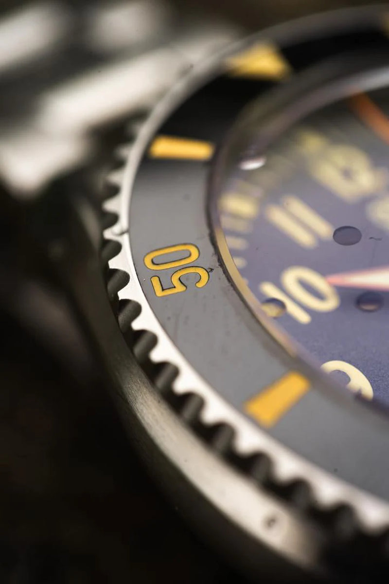 Close-up of Subnautica Automatic Diver Watch featuring a detailed bezel and vibrant dial.