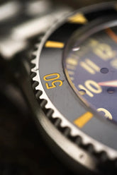 Close-up of Subnautica Automatic Diver Watch featuring a detailed bezel and vibrant dial.