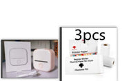 Portable mini label printer for students with printer paper and accessories.
