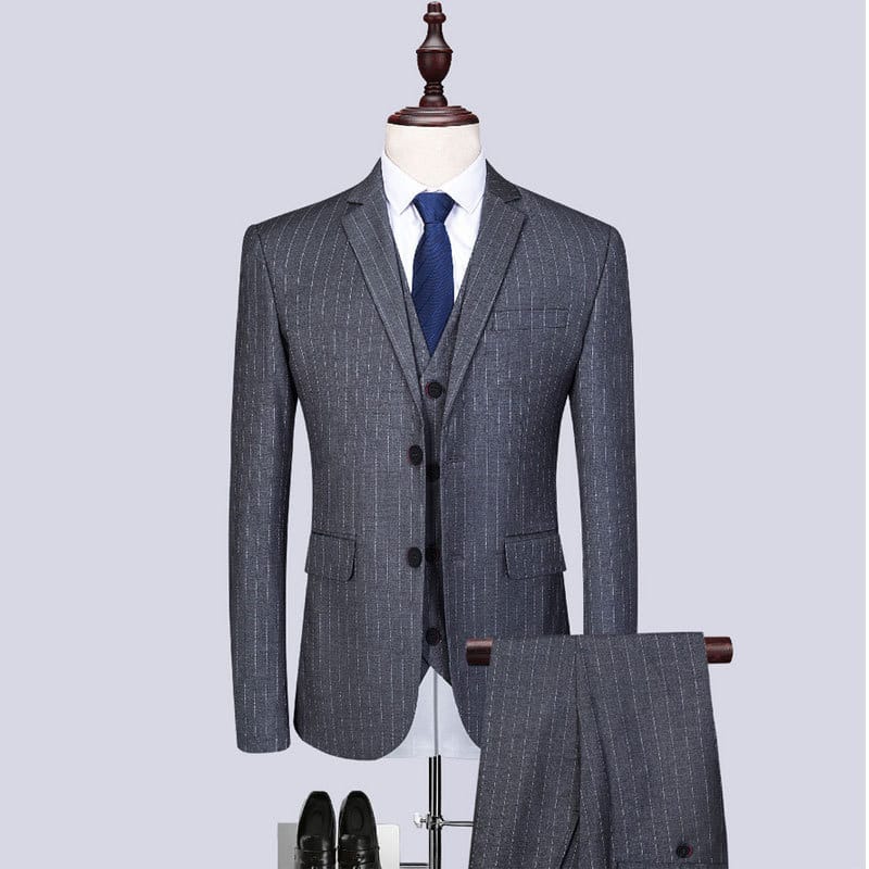 striped three-piece suit for men in gray with matching trousers and formal shoes, ideal for banquets.