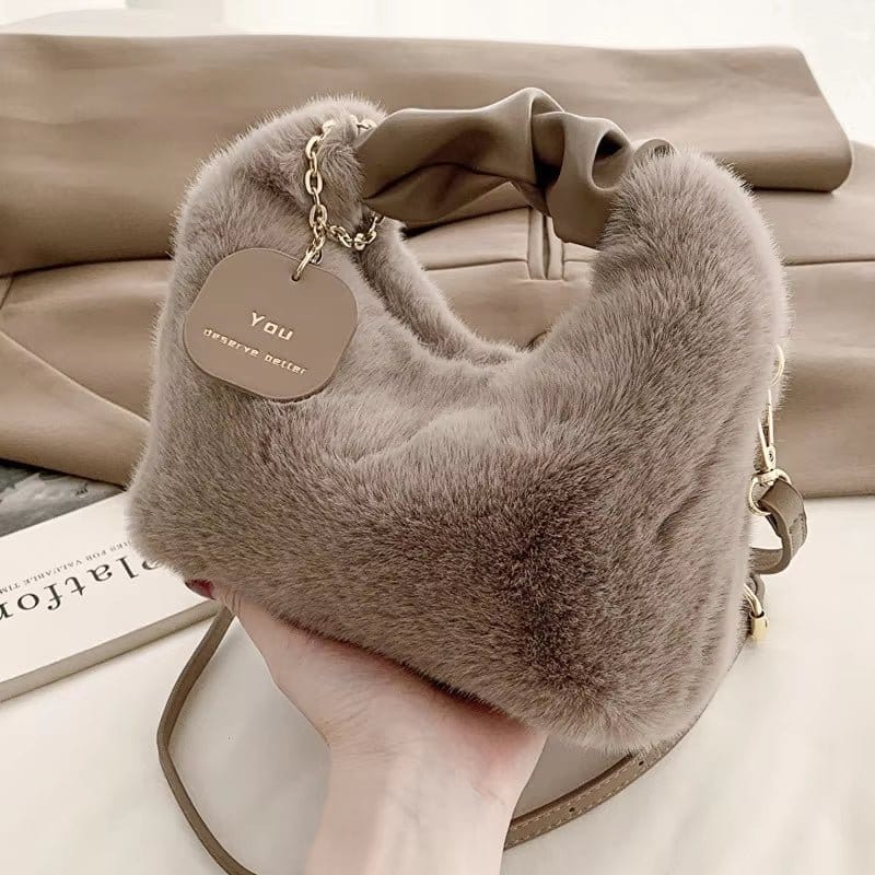 2023 women crossbody bag with red shoulder strap in soft fur material, featuring a unique design and stylish accents.