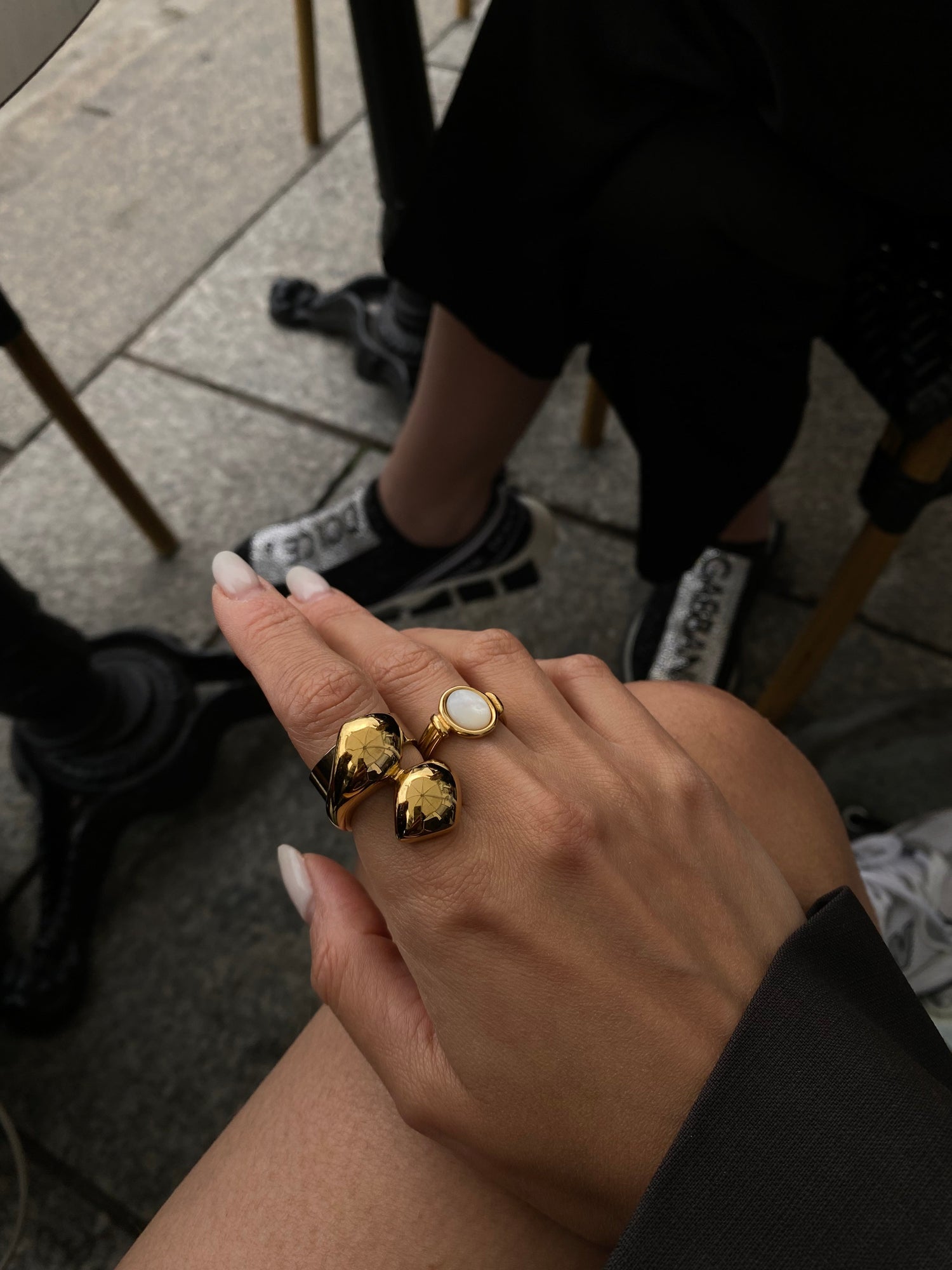 Neva Langais gold ring showcased on a hand, highlighting its unique design and craftsmanship, perfect for any jewelry collection.