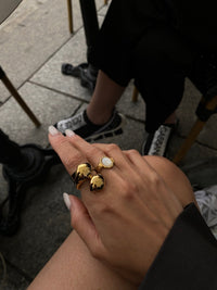 Neva Langais gold ring showcased on a hand, highlighting its unique design and craftsmanship, perfect for any jewelry collection.
