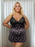 sleepwear for women featuring a pink floral printed chemise with lace detail bust modelled by a plus-size woman