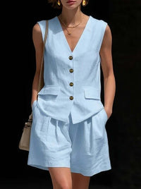 Womens cotton-linen summer vest and shorts set in light blue with a sleeveless design and button details.