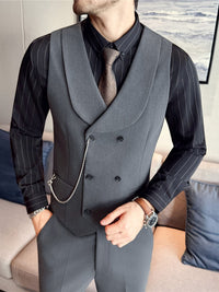 men's double-breasted shawl collar vest in gray, paired with a stylish black striped shirt and tie.