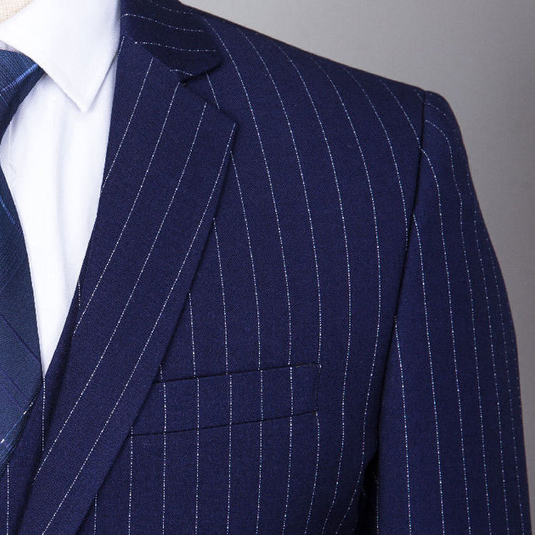 gray striped three-piece suit for men, detailed view of navy blue fabric and pinstripes, stylish urban fashion