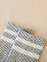 striped athletic crew socks in gray and white, designed for comfort and style, perfect for casual wear or workouts.