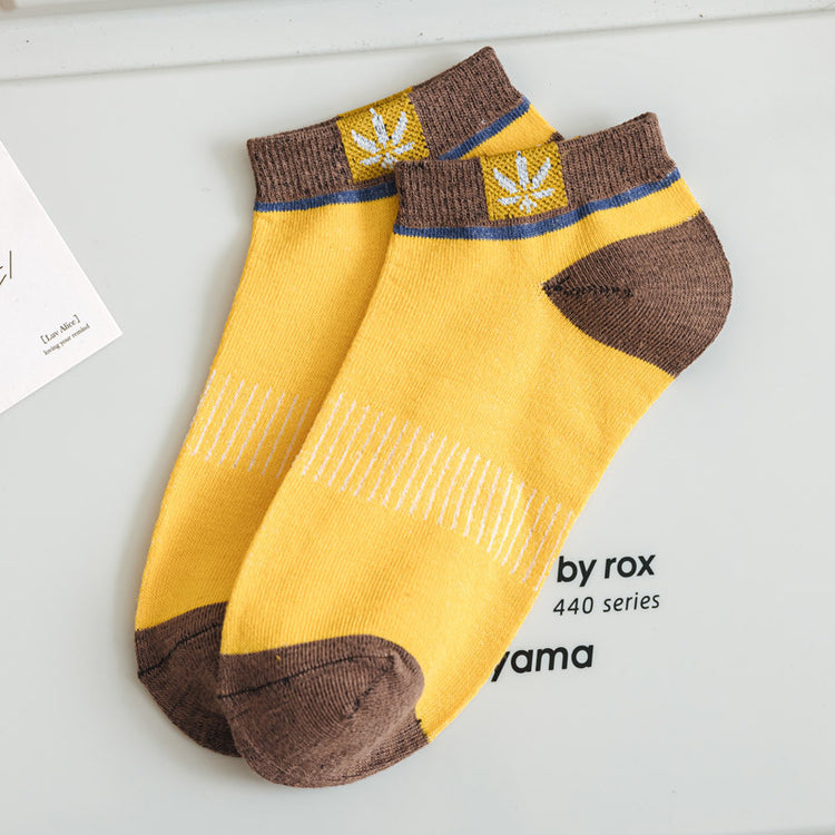 Maple Leaf Side-Logo Mens Short Socks in contrasting yellow and brown colors, featuring a plant pattern.