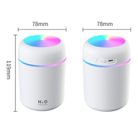 Portable aroma essential oil diffuser with colorful night light and compact design for home or office use.