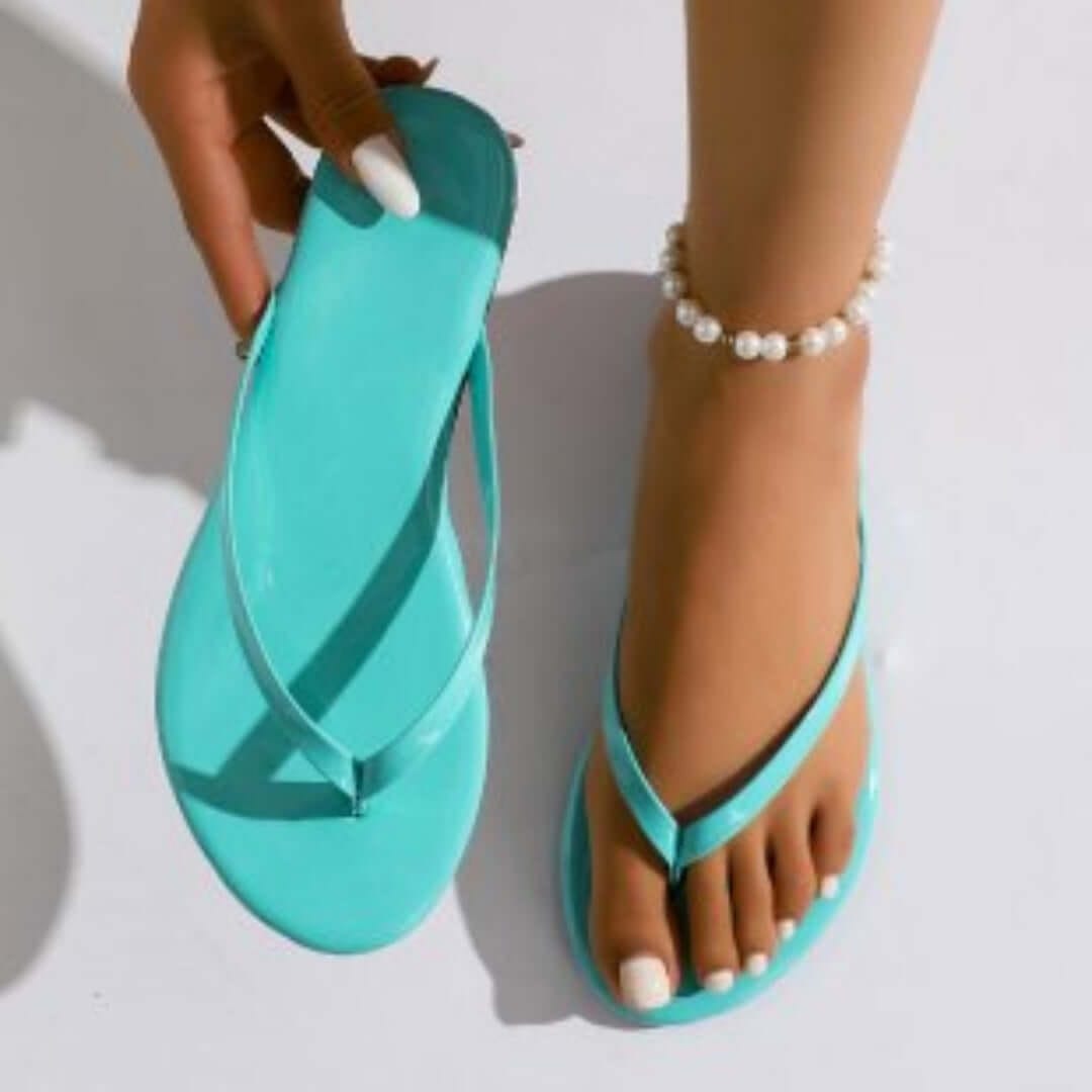 Women's casual beach flip-flops in turquoise color, stylish and perfect for summer beach wear.
