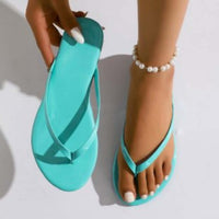 Women's casual beach flip-flops in turquoise color, stylish and perfect for summer beach wear.