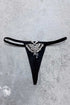 Death Moth Metal Thong - Small with detailed silver moth embellishment on a black fabric background.