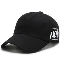 four seasons baseball cap in black, embroidered with 'NOW', perfect for all seasons and sun protection.