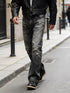 Man walking in stylish Shanxi stretchy slim straight pants with a leather jacket on city street.