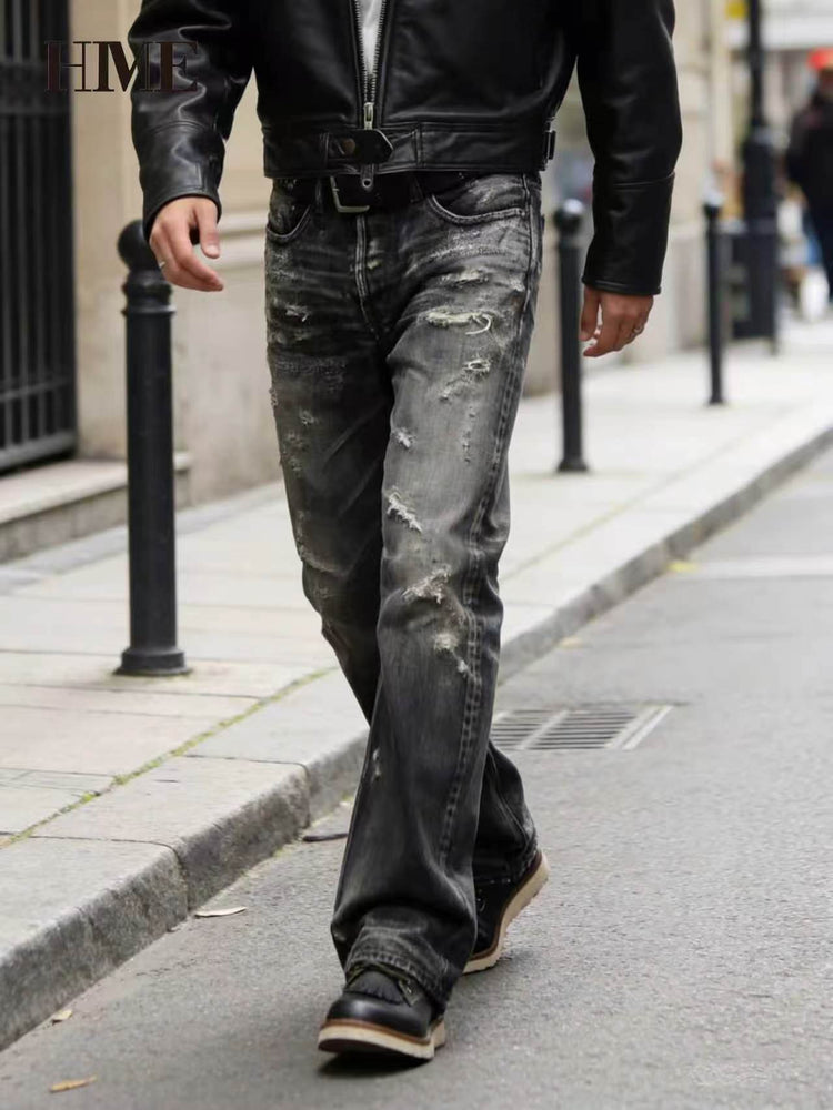 Man walking in stylish Shanxi stretchy slim straight pants with a leather jacket on city street.