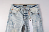 Close-up view of Shanxi stretchy slim straight pants for men with light blue wash and visible stitching details.