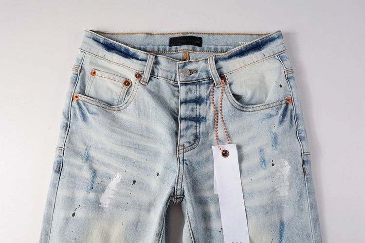 Close-up view of Shanxi stretchy slim straight pants for men with light blue wash and visible stitching details.