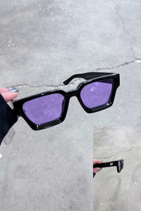 Color Shades - Teddy featuring edgy black frame and purple lenses, perfect for making a bold statement.